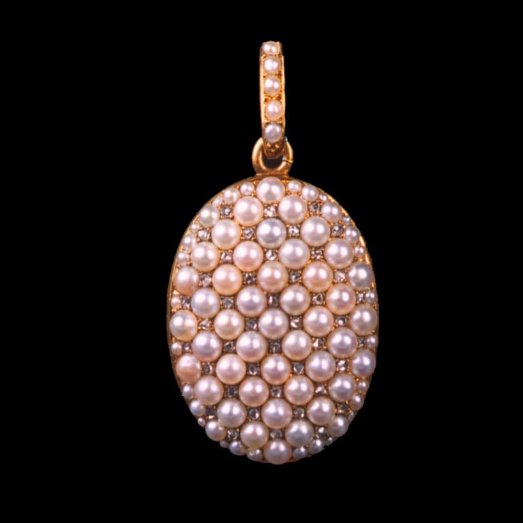 A Victorian Oval Pearl And Diamond Locket Pendant