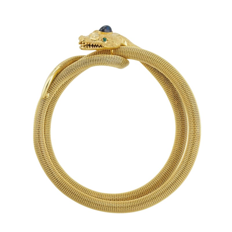 A vintage sapphire and emerald gold snake bangle