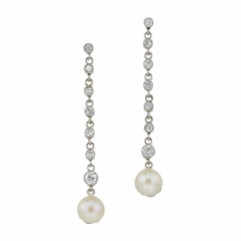 A pair of Edwardian natural pearl and diamond earrings