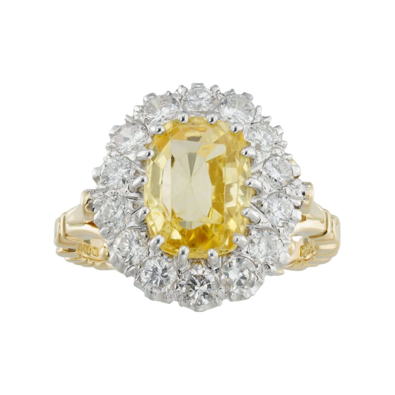 A vintage yellow sapphire and diamond cluster ring