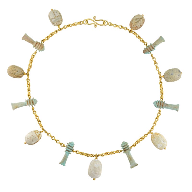 A gold necklace with ancient Egyptian faience