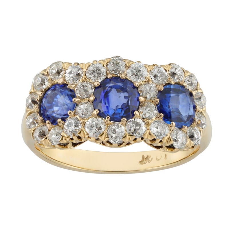 A three stone sapphire and old-cut diamond cluster ring,