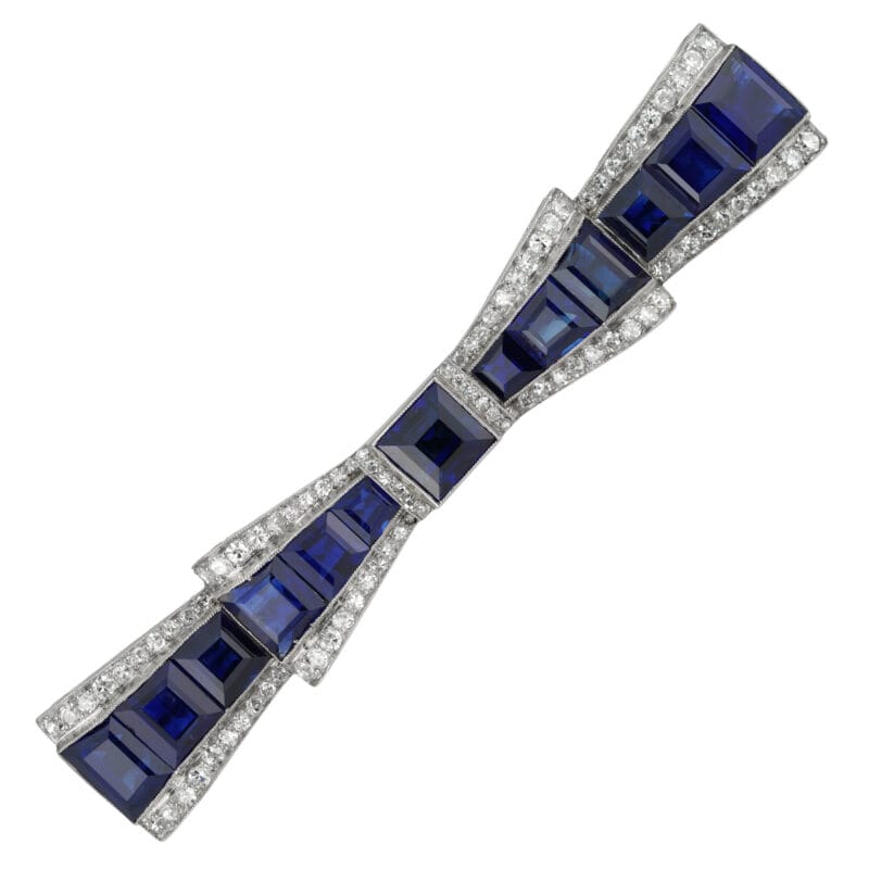 A mid-20th century sapphire and diamond bow brooch