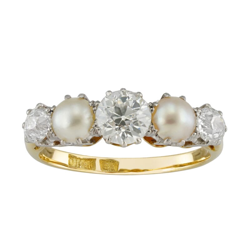 An early 20th century diamond and half pearl five-stone ring