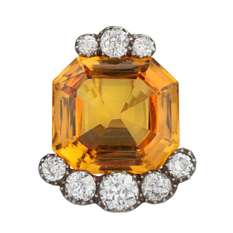 A golden topaz and diamond double pin brooch