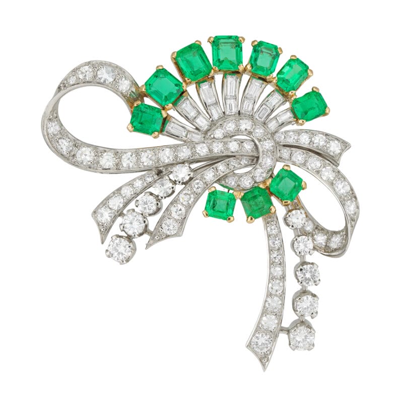 A mid-century emerald and diamond spray brooch
