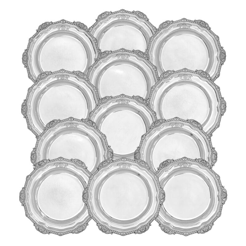 A set of twelve Regency silver dinner plates by Paul Storr