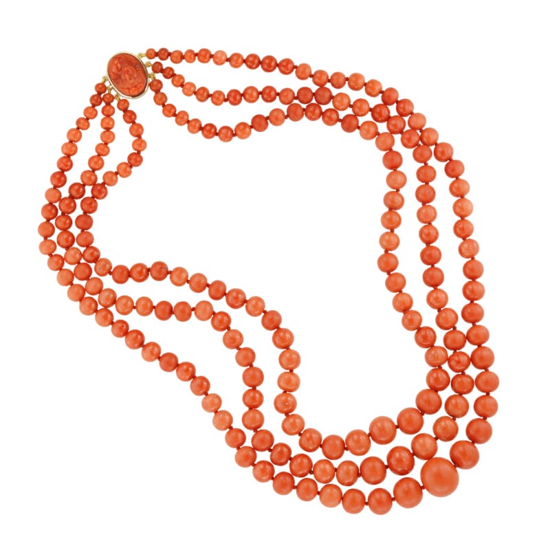 An early 20th century triple-row coral bead necklace
