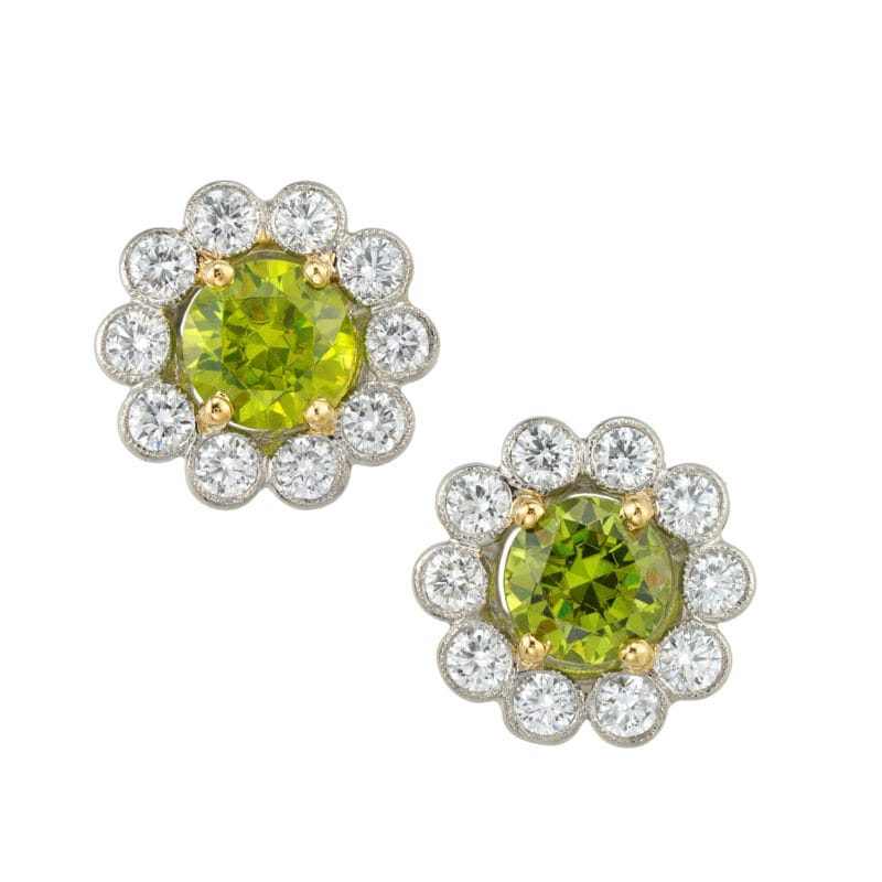 A pair of demantoid garnet and diamond cluster earrings