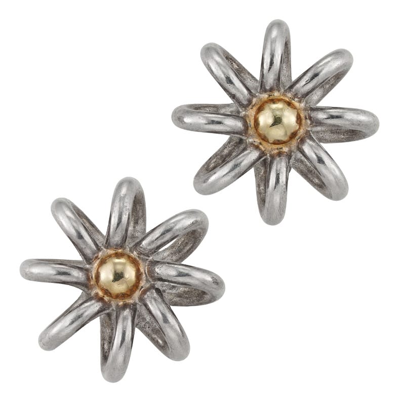 A pair of silver and gold earrings by Lucie Heskett-Brem